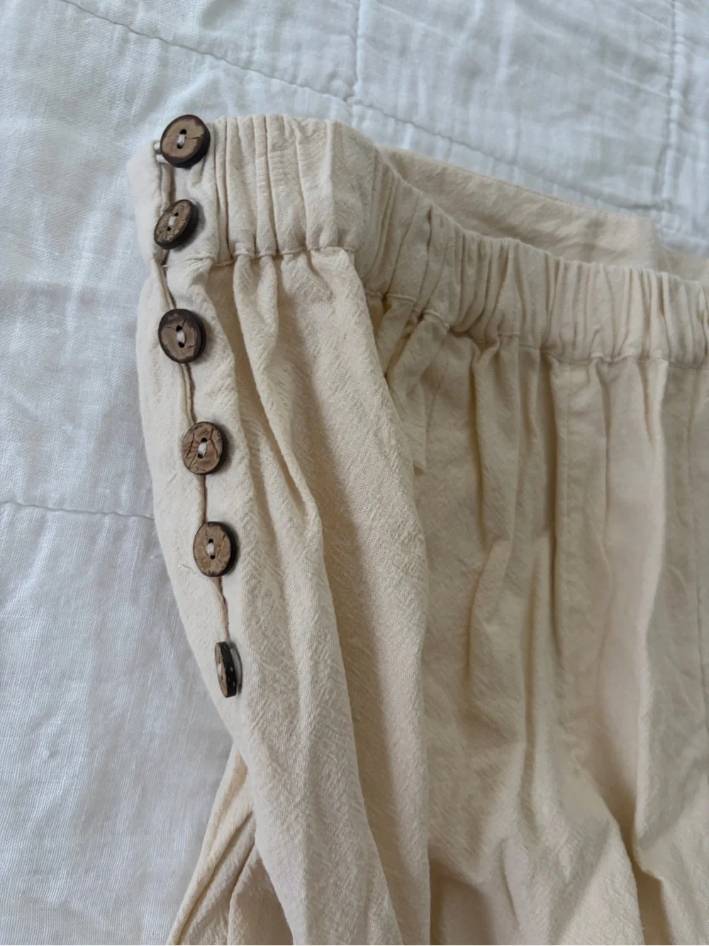 Free People Pleated Two-Tone Mini Shorts in Cream and Black